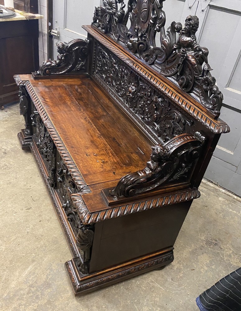CARVED FIGURAL WALNUT BENCH