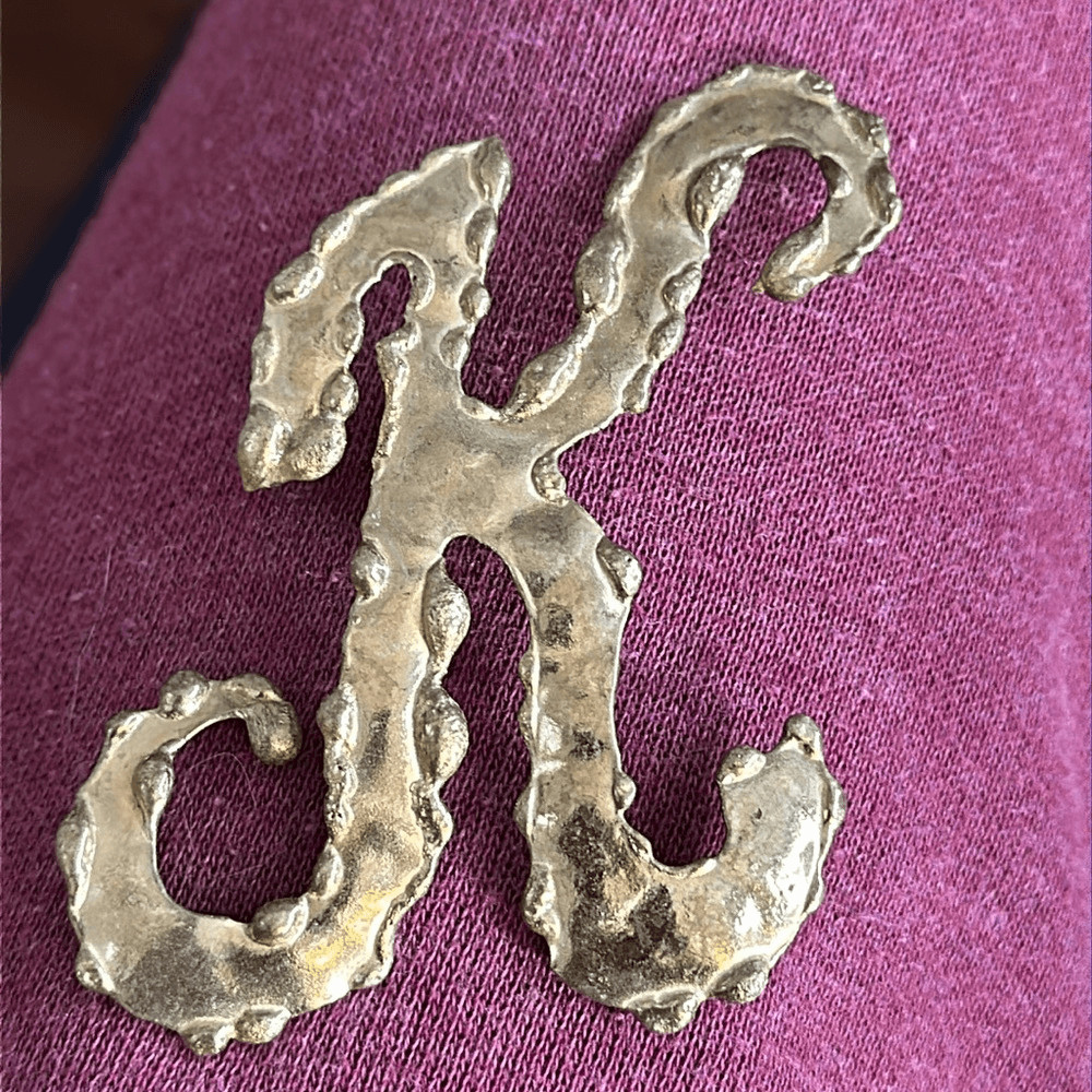 Vintage hammered brass K”