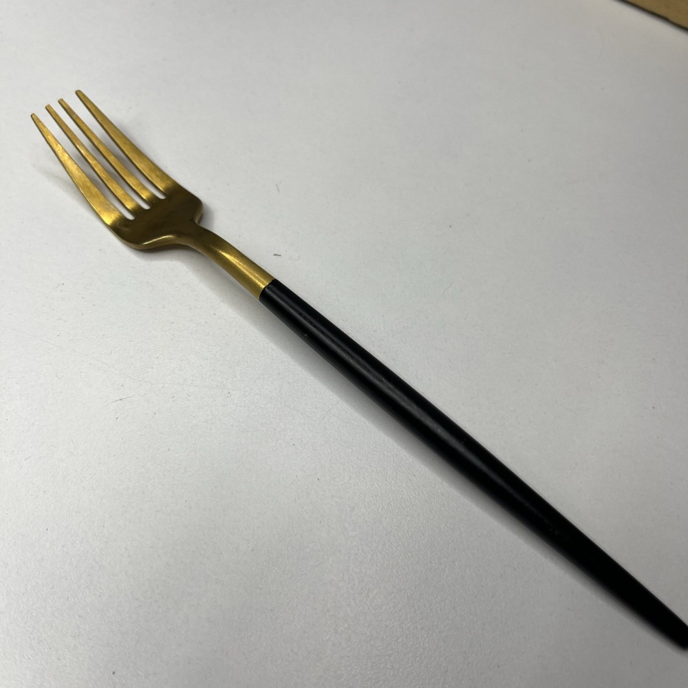 Gold Tone Fork With Matte Black Rounded Handle Modern And Elegant