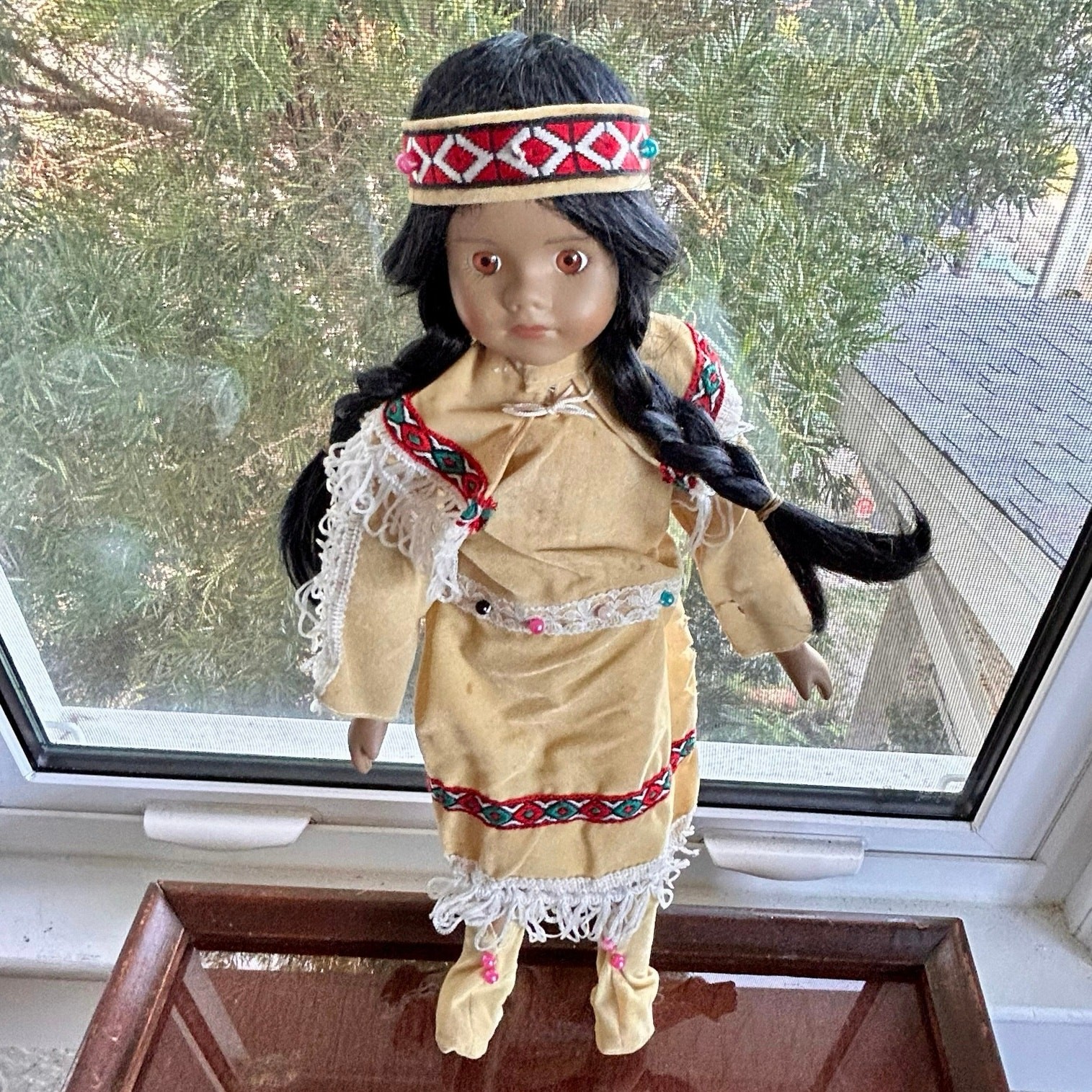 Vintage Porcelain Native American-Inspired Doll with Braids and Beaded Outfit