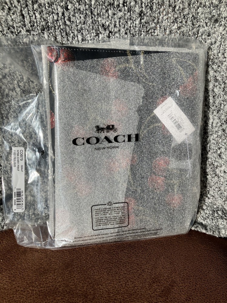 NWT Coach Notebook Cherry with gold/black multi 100% authentic. Purchased direct