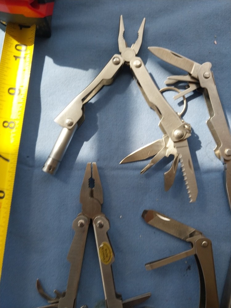 4 small multitudes with pliers knife scissors screwdriver's