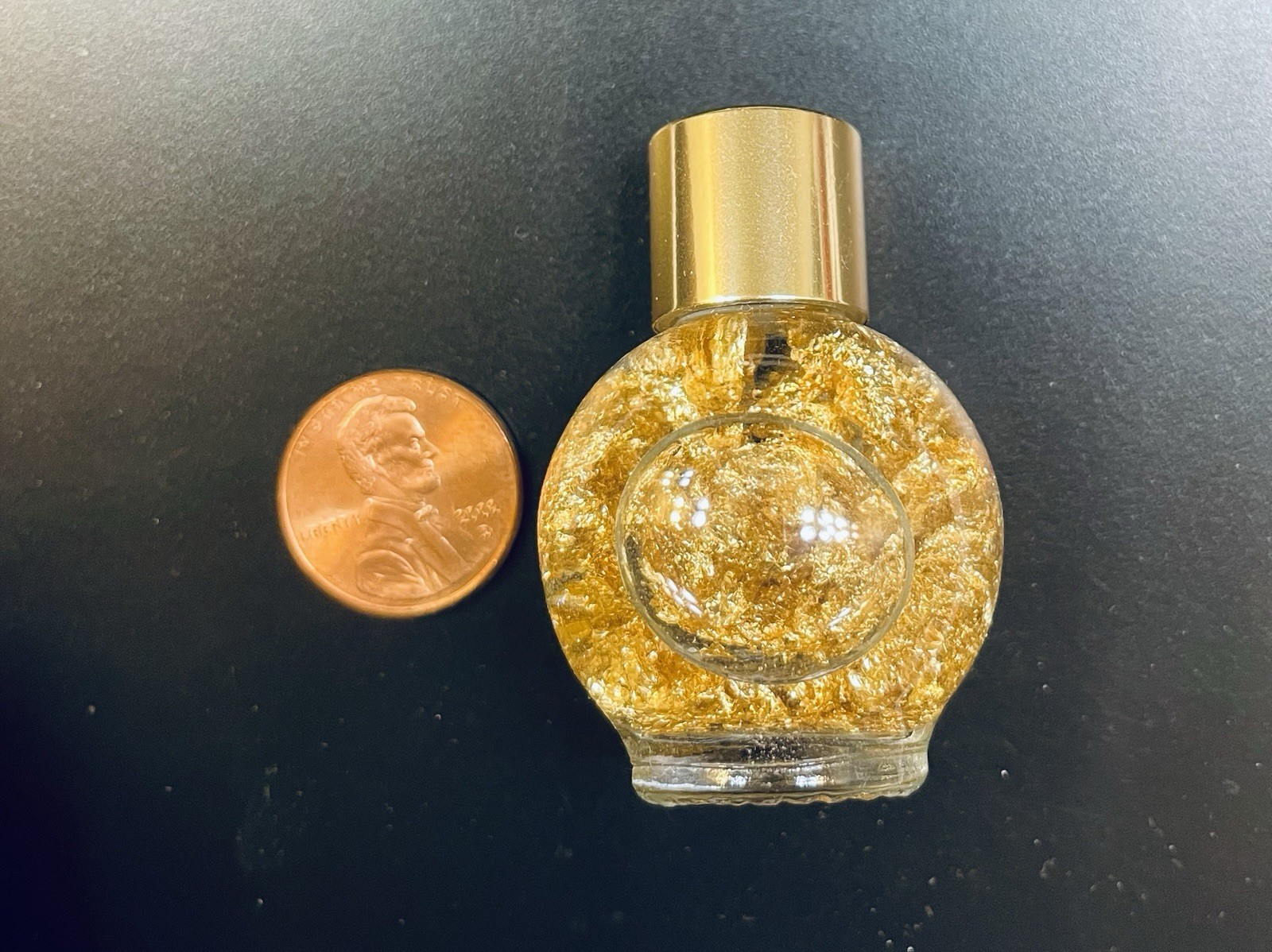 Pure Gold Leaf Flakes in a Sealed Bottle