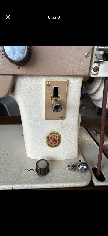 Antique Singer sewing machine set in a wooden table
