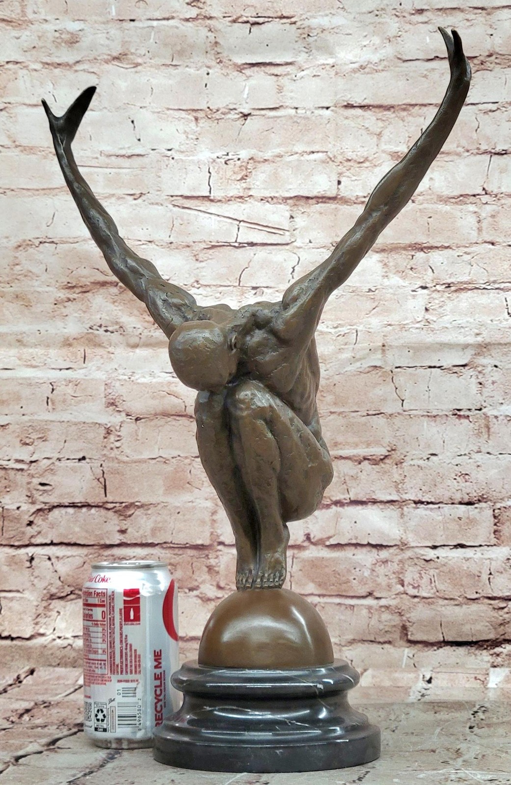 Abstract Bronze Male Figure Balancing on Sphere with Outstretched Arms Sculpture