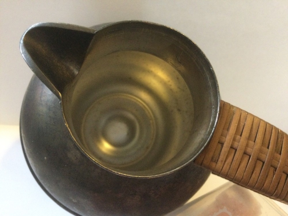 vintage silver plated pitcher with rattan handle