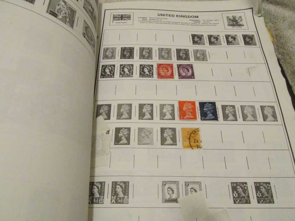 VINTAGE Planet Earth Worldwide Stamp Album Preowned wit FEW STAMPS