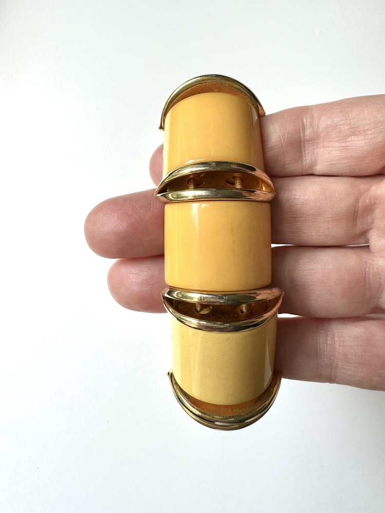 Nice butterscotch bakelite expandable bracelet with deco gold inserts