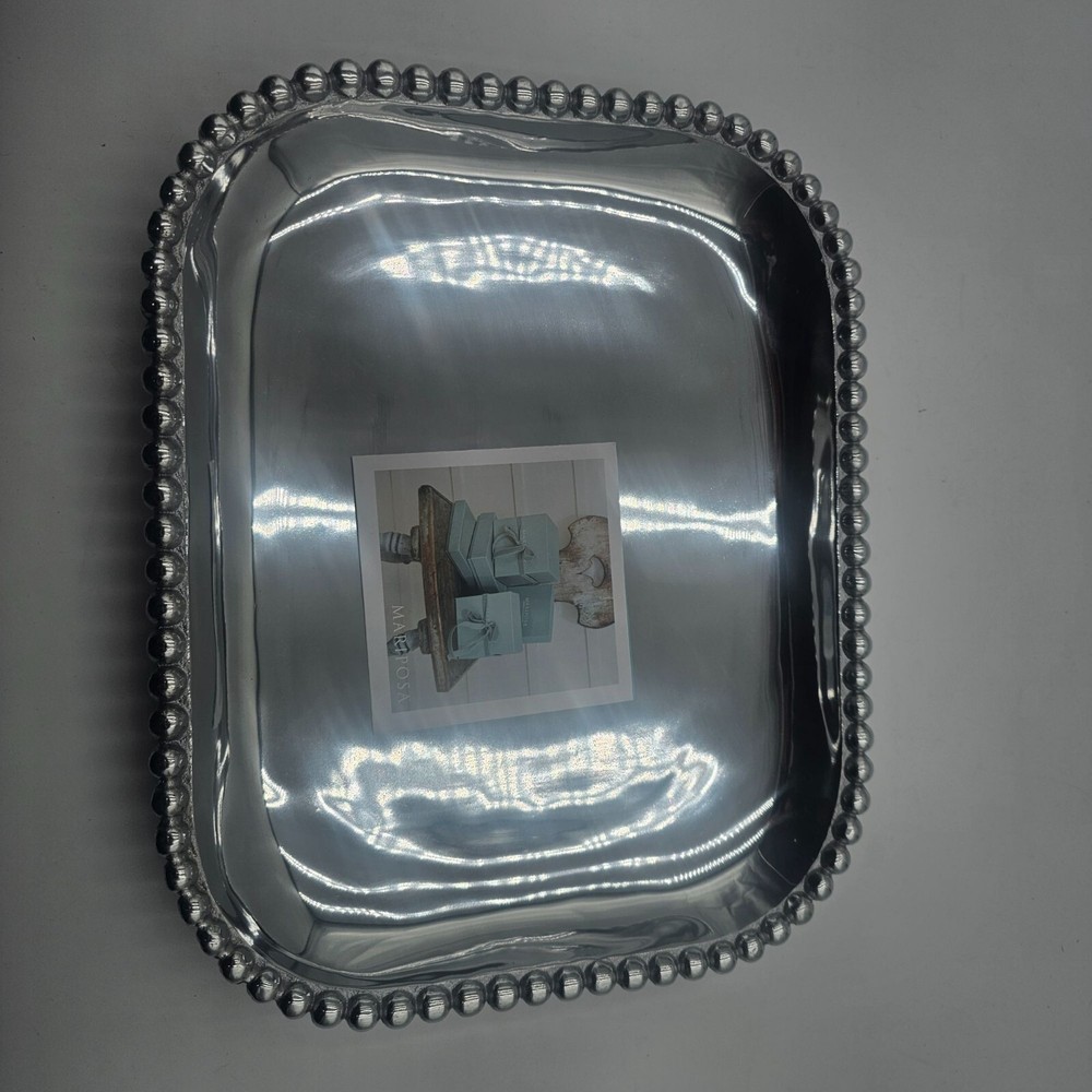 Rectangular platter with beaded edge. Made from recycled aluminum. Imported.