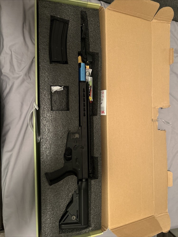 Airsoft AEG Matrix, custom muzzle and comes with Red Dot and irons.