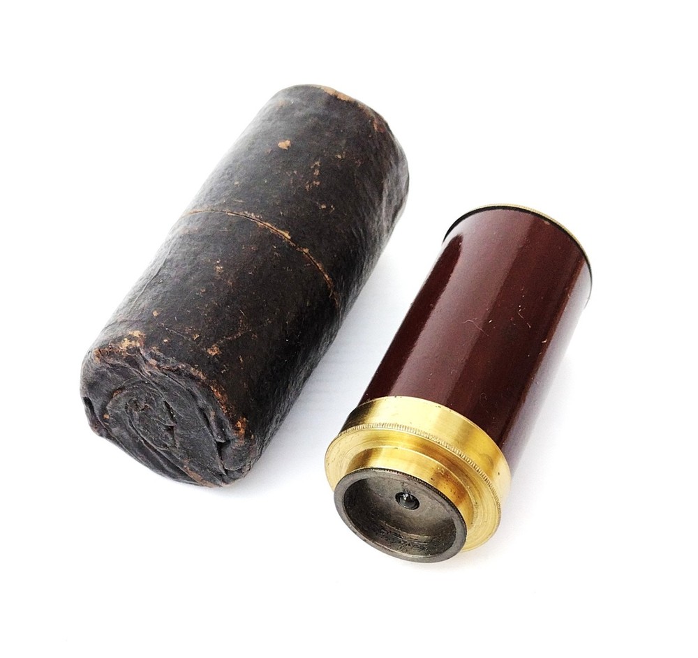 Brass microscope in case.