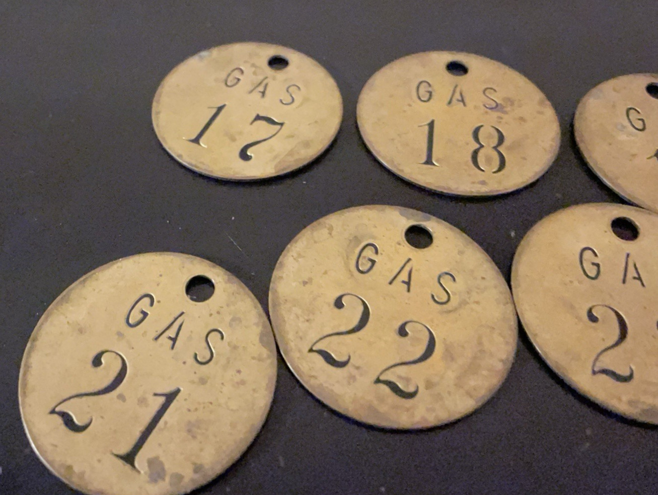 Lot of 9 vintage brass gasoline tags