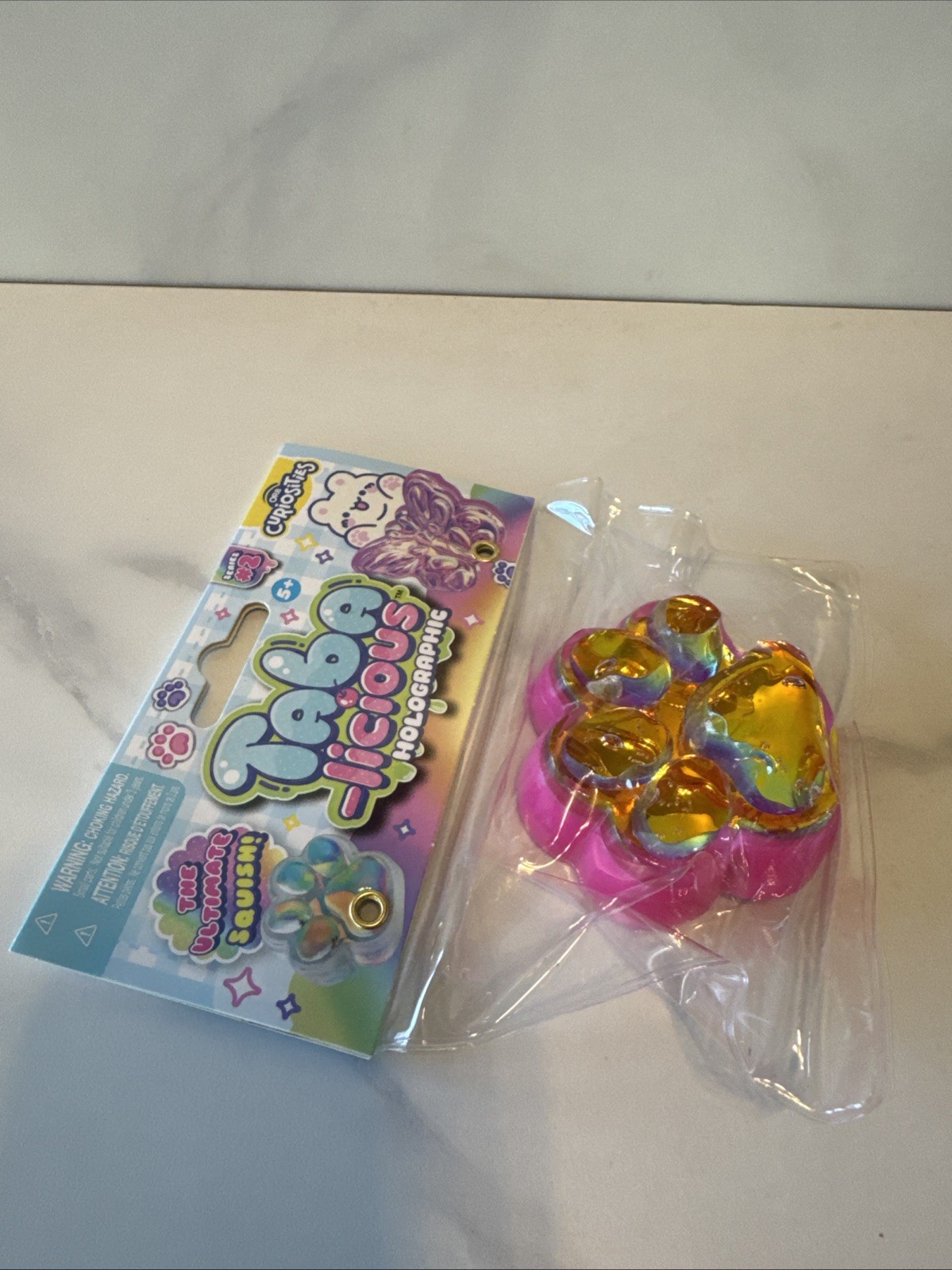 Orb Toys TABA-licious Holographic Paws Paw Print Ultimate Squish Toy Pink Gold
