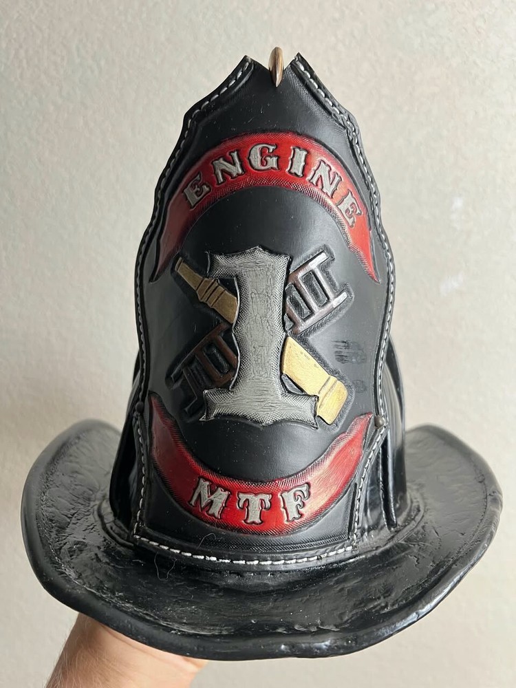 John Olson Vintage leather firefighters helmet.