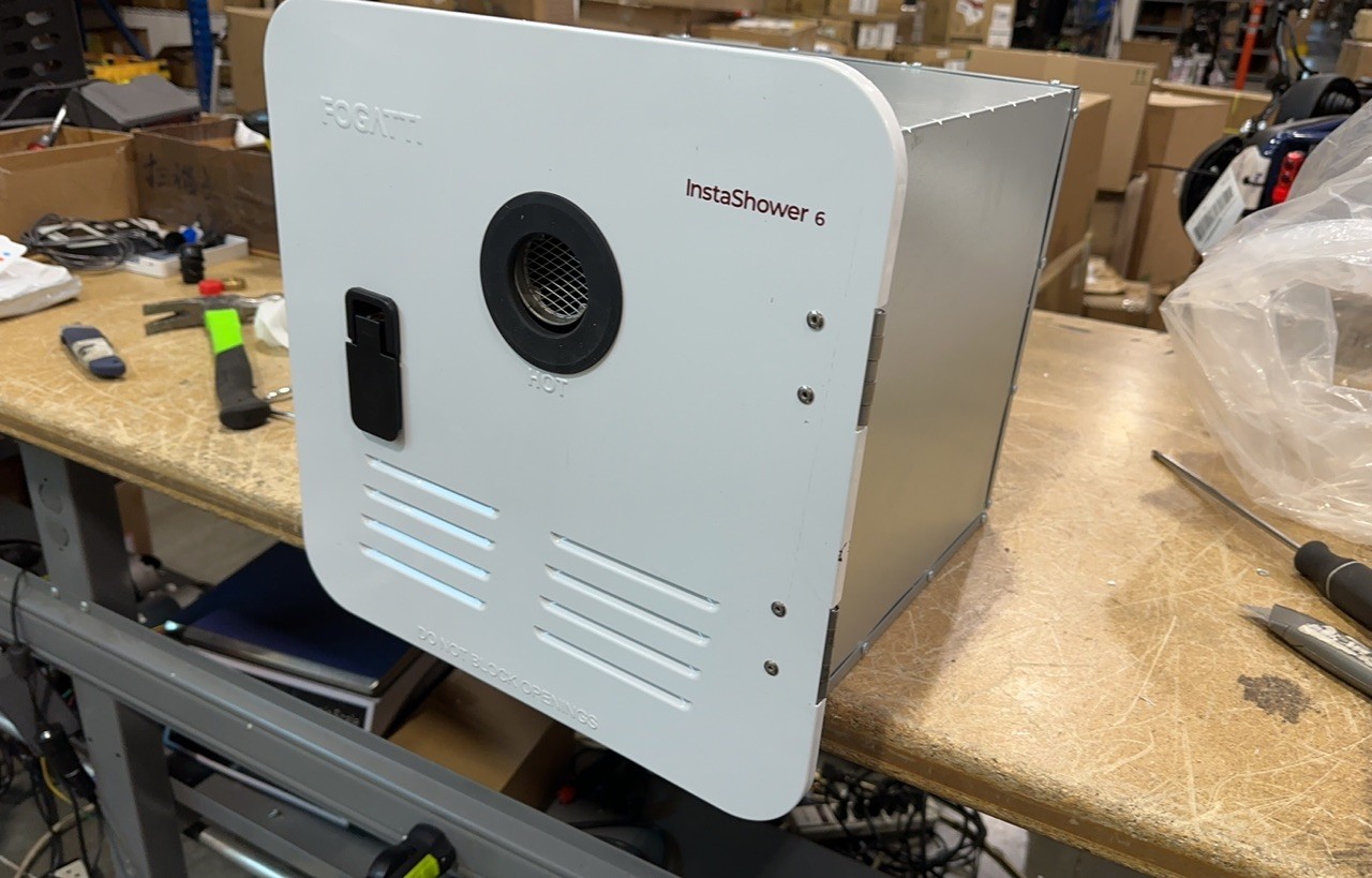 Used 2.5GPM 48,000 BTU RV Tankless Water Heater with 15x15 White Door