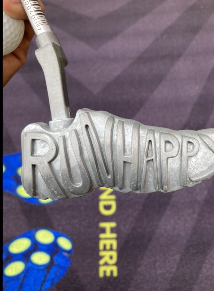 Brooks golf putter with putting mat