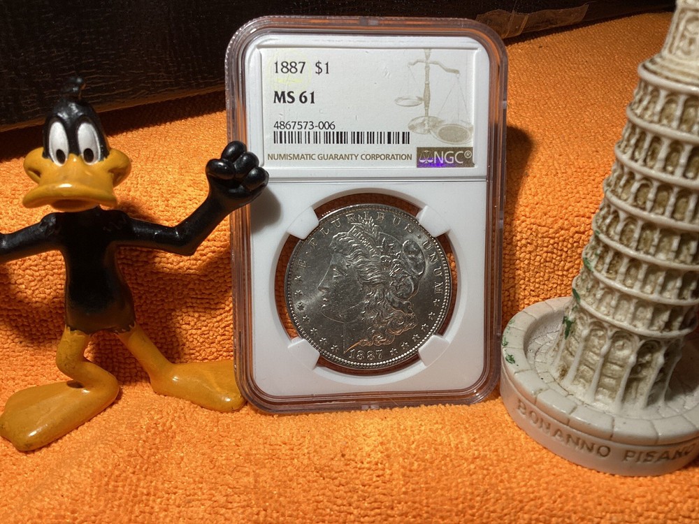 1887 MORGAN SILVER 💰 NGC MS61