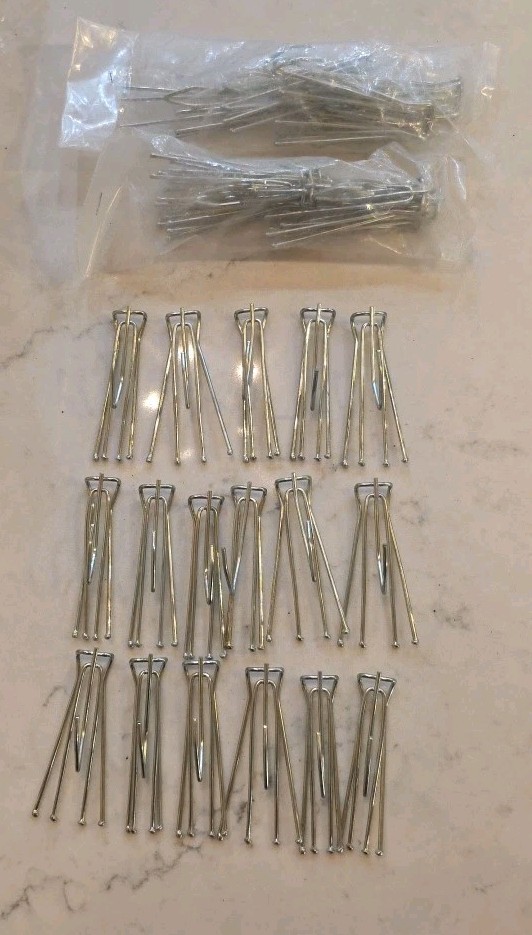 14 curtain hooks 4 prongs with extra hook on bottom.
