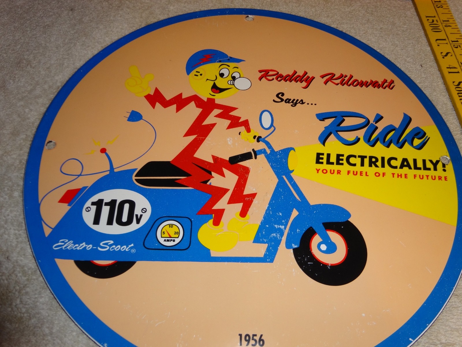 VINTAGE 56 REDDY KILOWATT ELECTRIC SCOOTER 11 3/4" PORCELAIN METAL GASOLINE SIGN