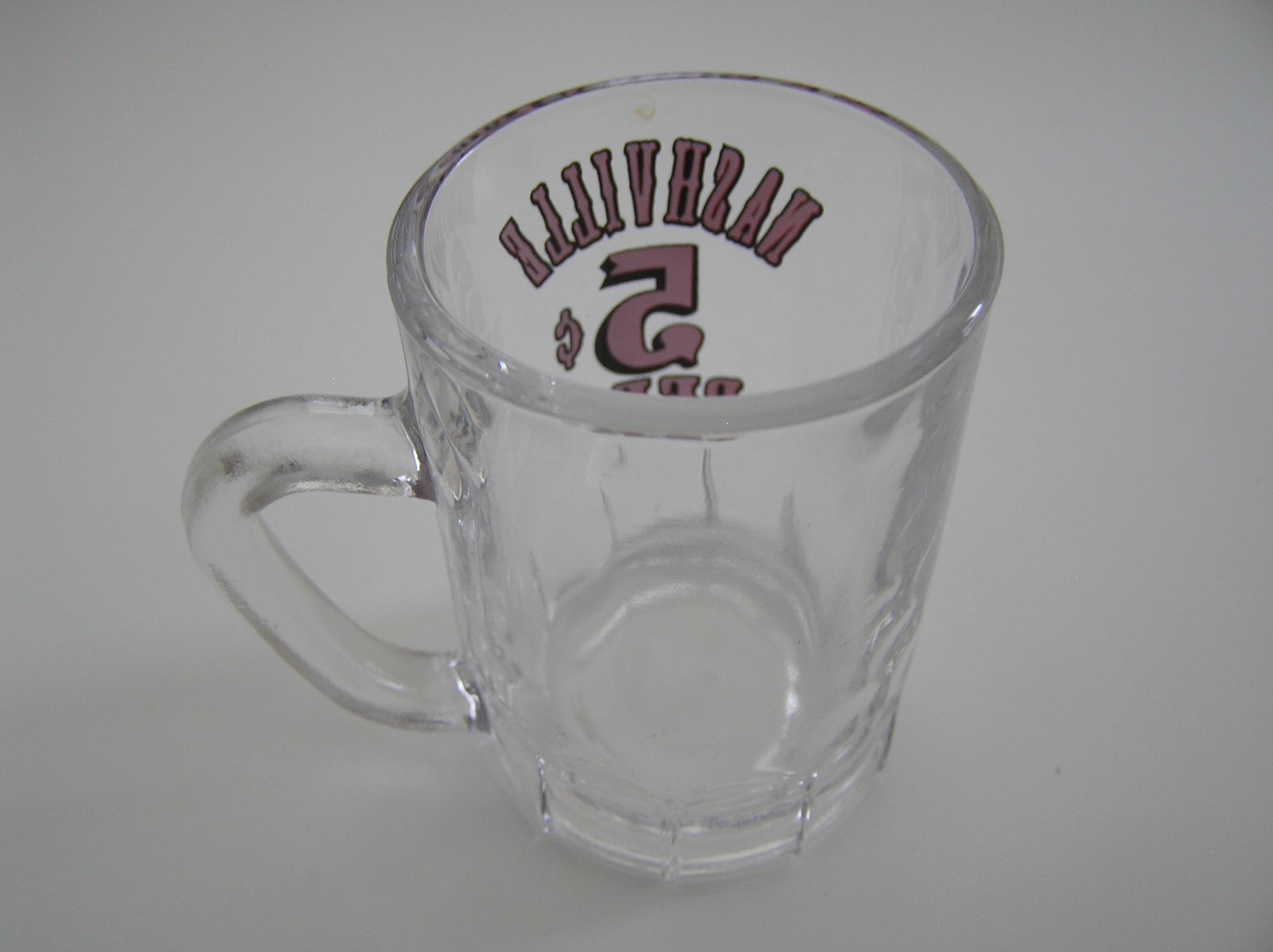 2 Souvenirs Shot Mugs: A Black Rumple Minze and A Clear Nashville 5cents Beer