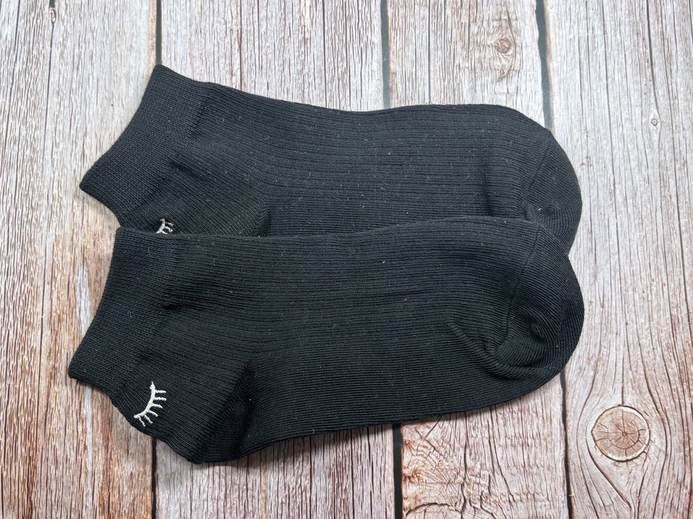 Socks with embroidered lashes