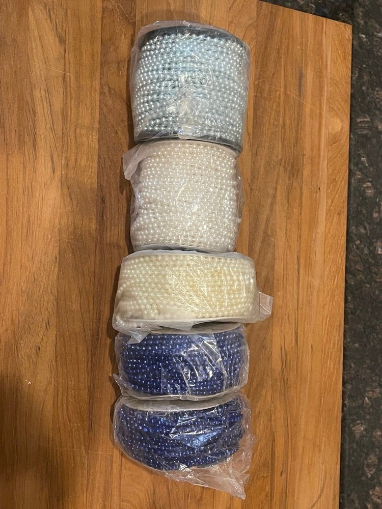 5 rolls of plastic string beads