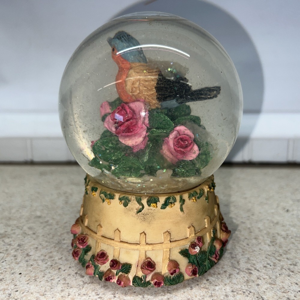 Vintage bird snow globe