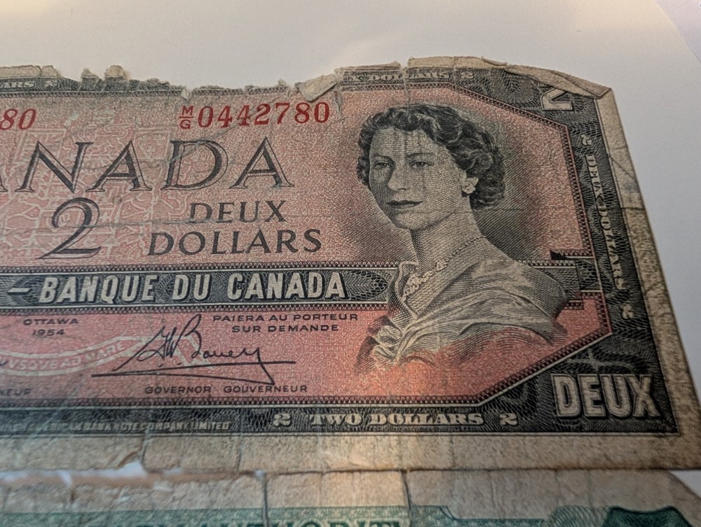 $2 Canadian Note. $1 Bahamas Note