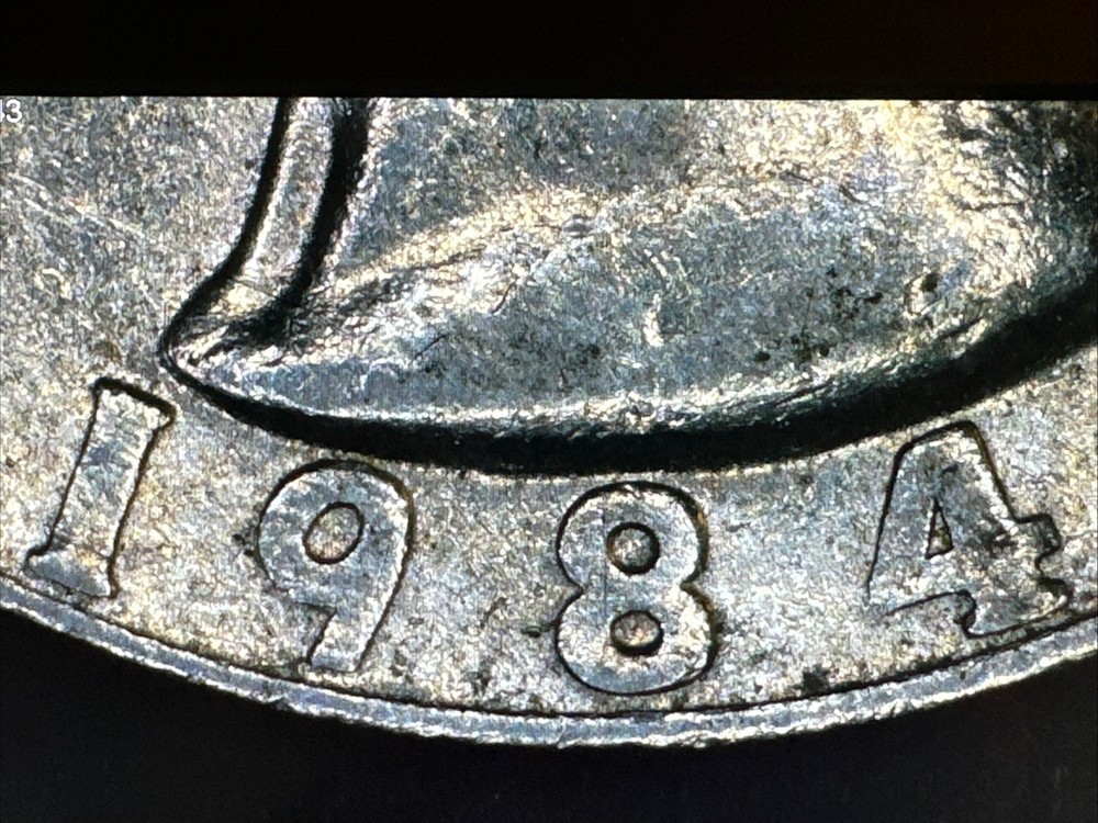 1984 P Quarter Reverse Major Grease Strike Through Error, Slightly Tilted