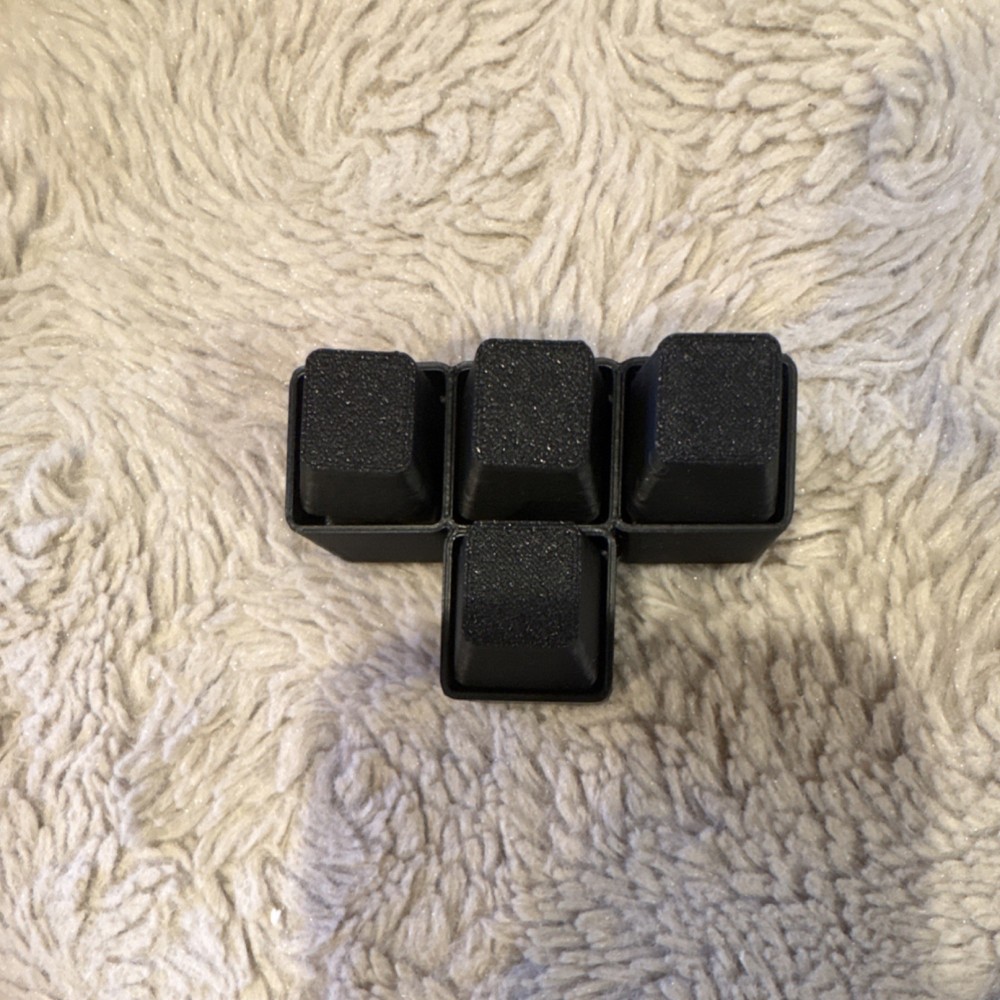 3-D Printed black WASD fidget keys