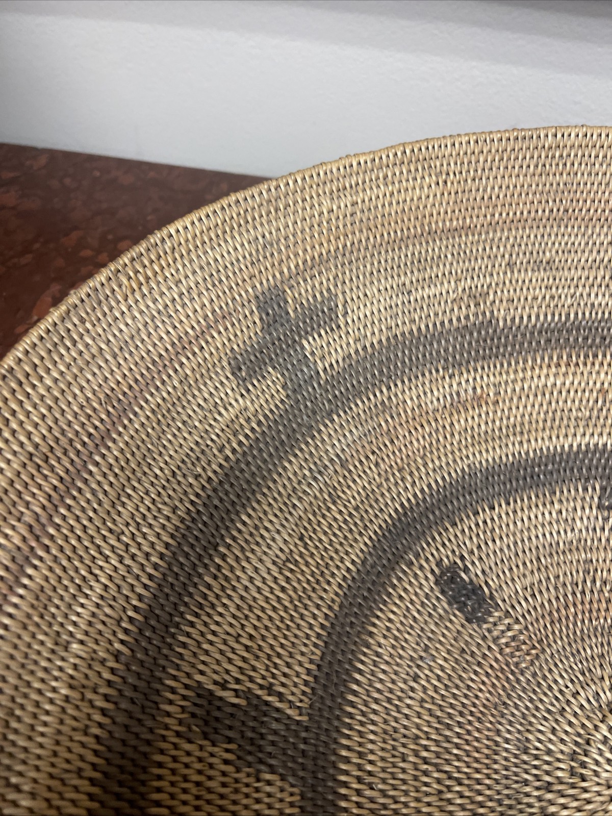 Woven Apache pictorial 17 1/4” basket with geometric and symbolic designs.