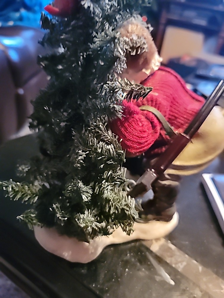 Santa Hiding By A TREE