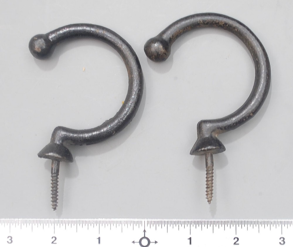 Two enameled under-rail bridge hooks