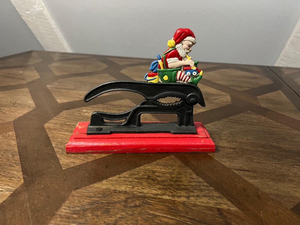 Old Fashioned Nutcracker Cast Iron on Wood Base santa theme nutcracker vintage