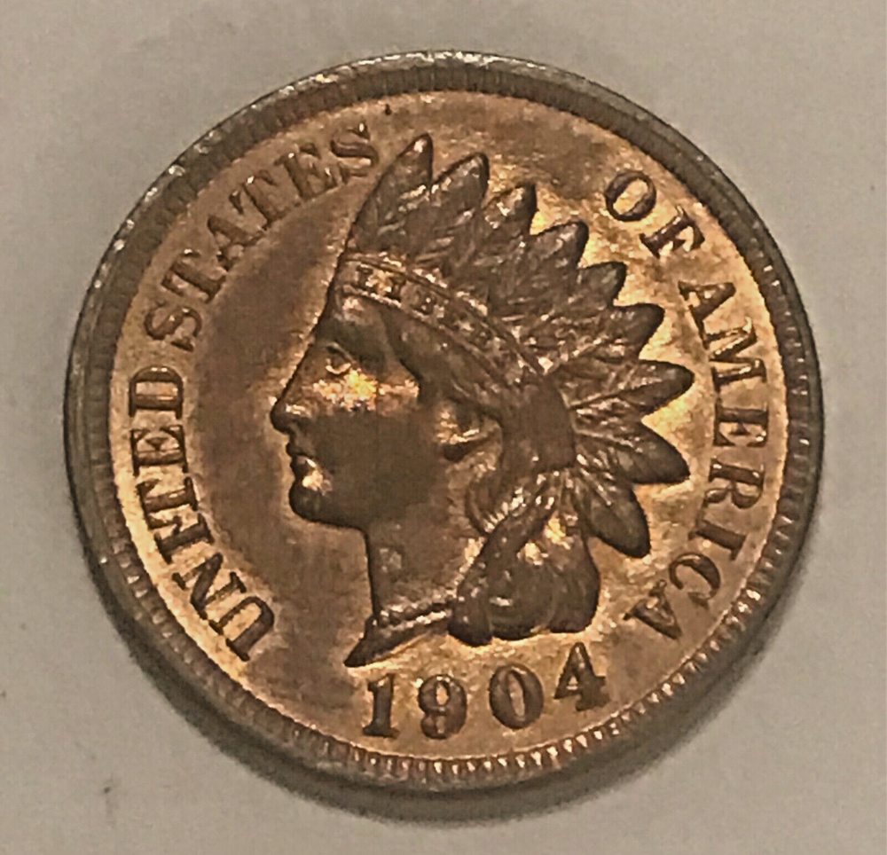 1904 Indian cent , uncirculated, mostly brown, some red remains