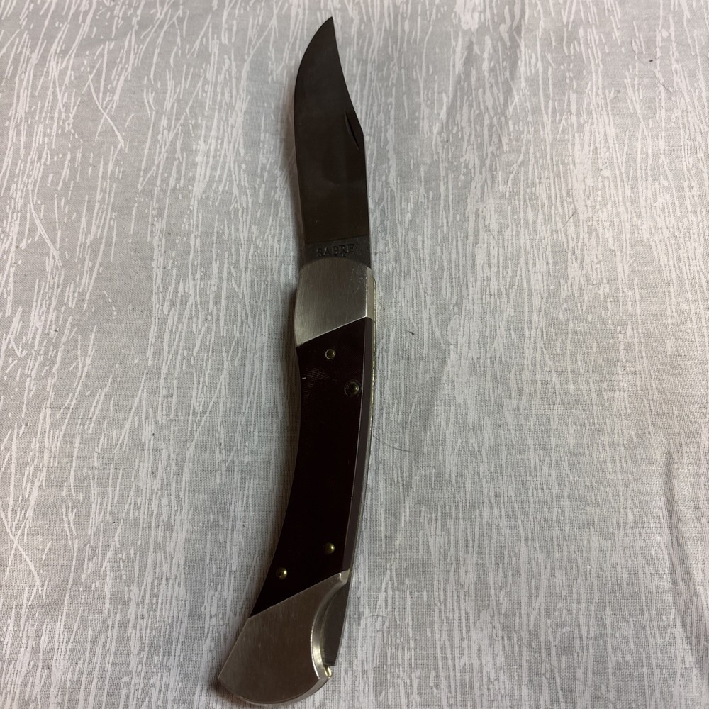 SHARP SABRE U.S.A Kinfe With Leather Covering.