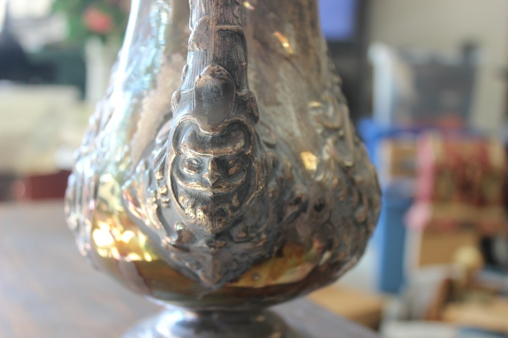 Silver or Silver-plate coffee pot with many animals embossed. July 8th 1856