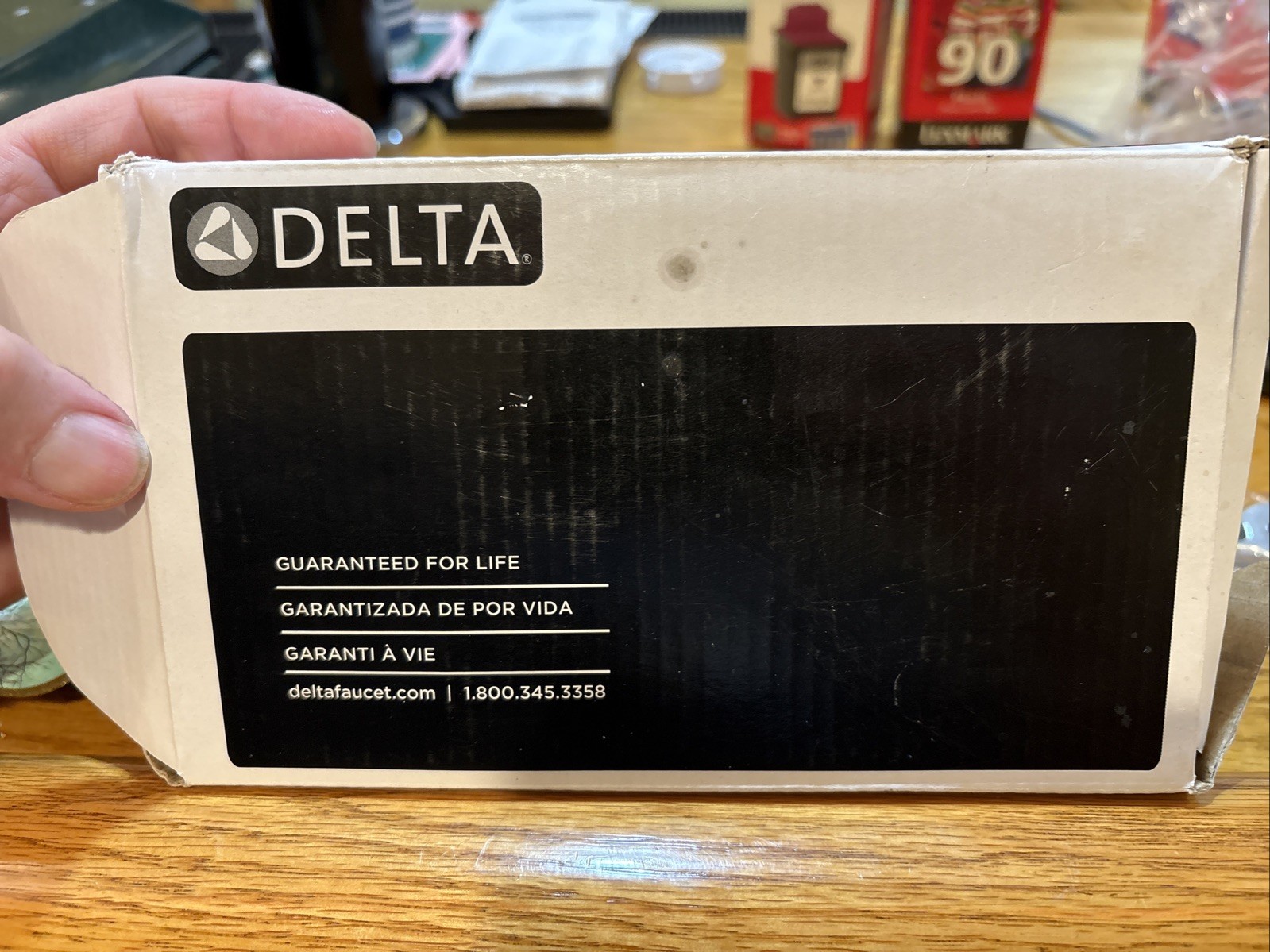 Delta 73350-BL Kayra Wall Mounted Pivoting Toilet Paper Holder, Matte Black.