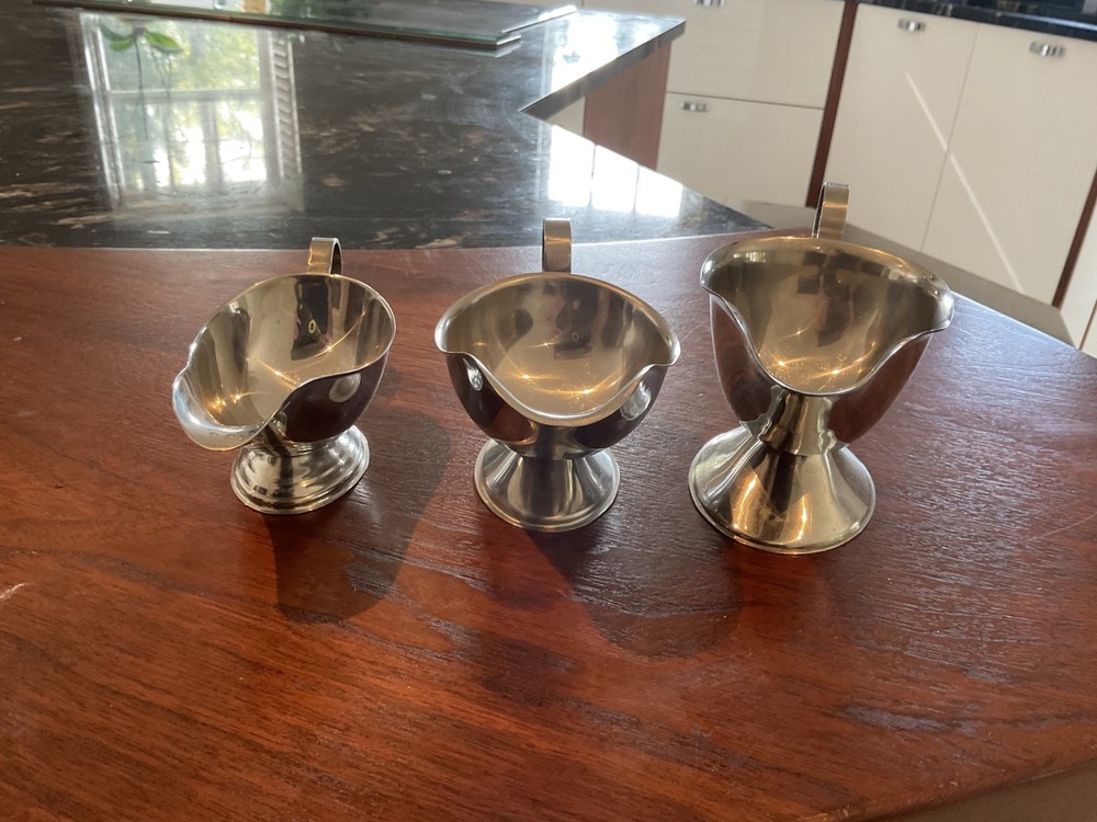 THREE SILVER COLOUR SAUCE BOATS GRADUATED