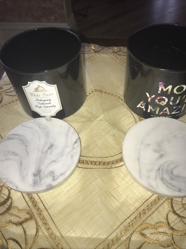 2 empty black candle jars with marble like lid
