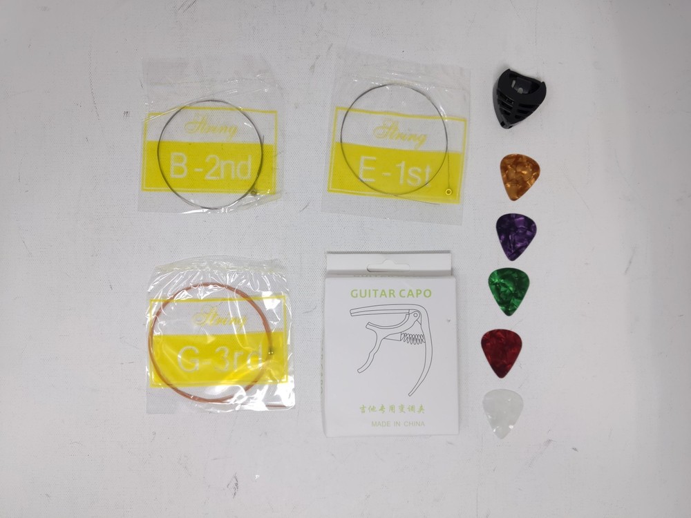 18pc Guitar Kit Capo + Strings + Picks + Pick Box + Guitar Checker Strap