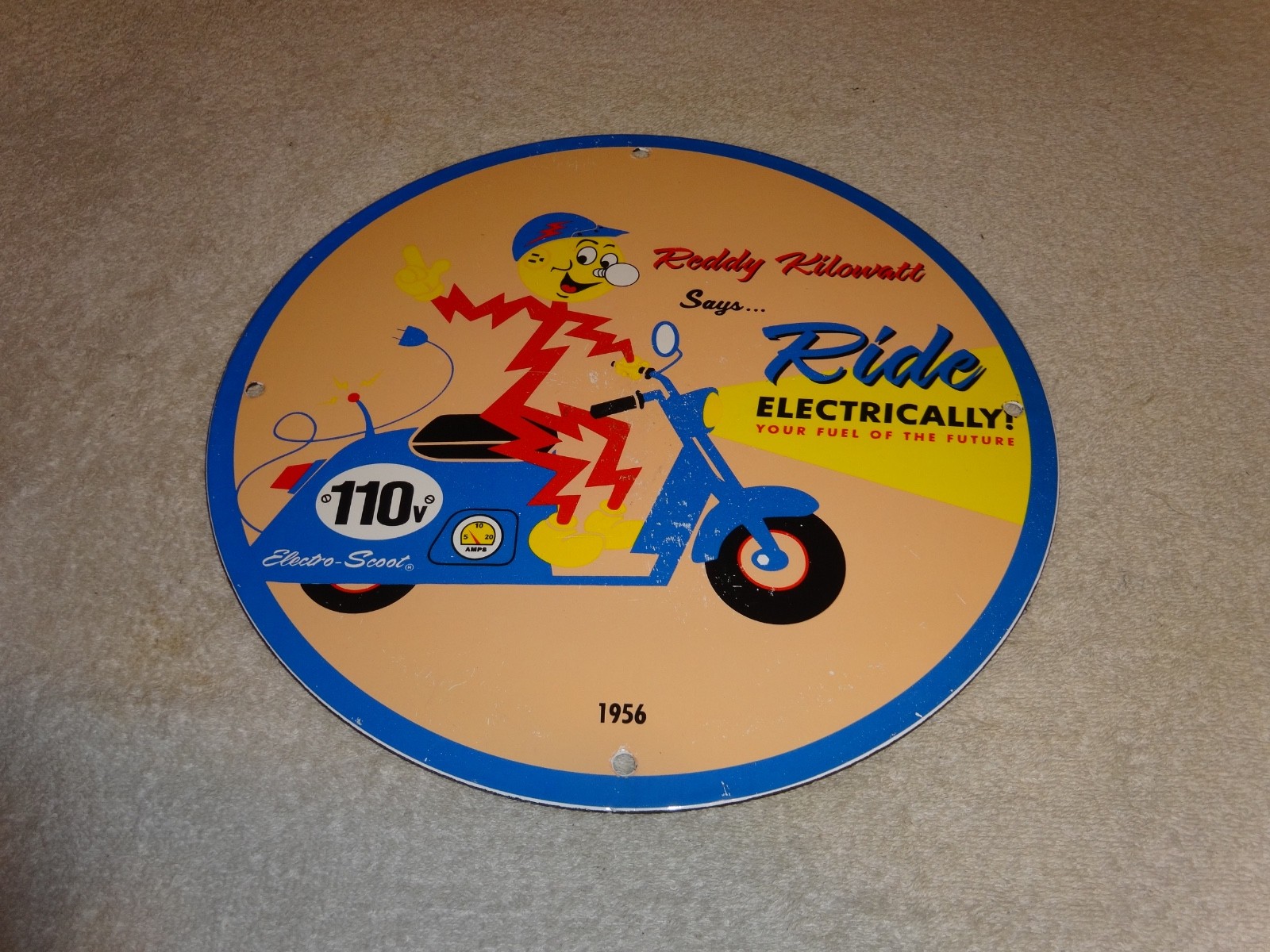 VINTAGE 56 REDDY KILOWATT ELECTRIC SCOOTER 11 3/4" PORCELAIN METAL GASOLINE SIGN