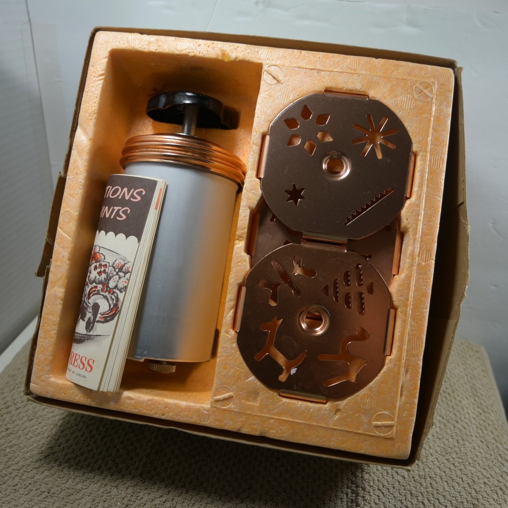 Mirro Dial a cookie cookie press copper colored top and inserts